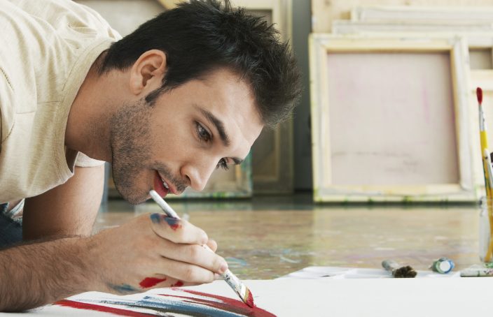 man painting in his studio