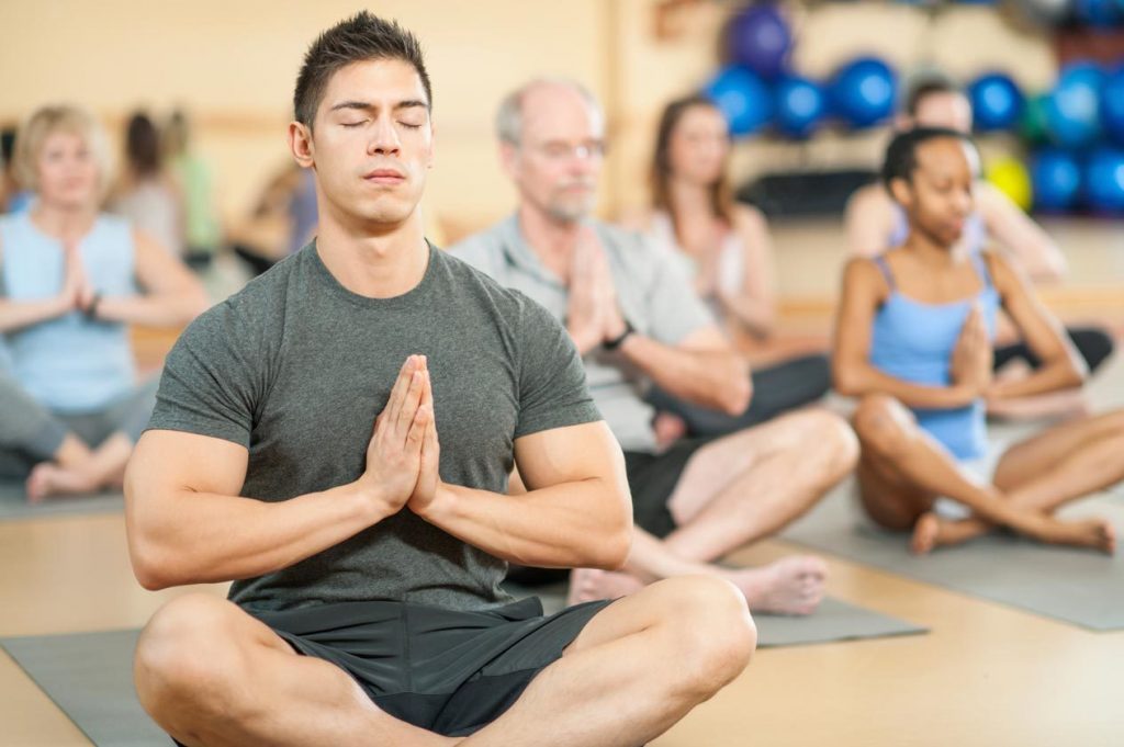 man trying out yoga