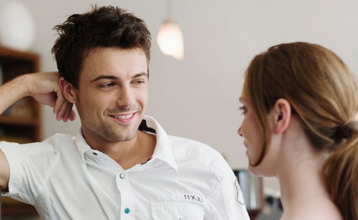 man looking at a woman in a confident stance