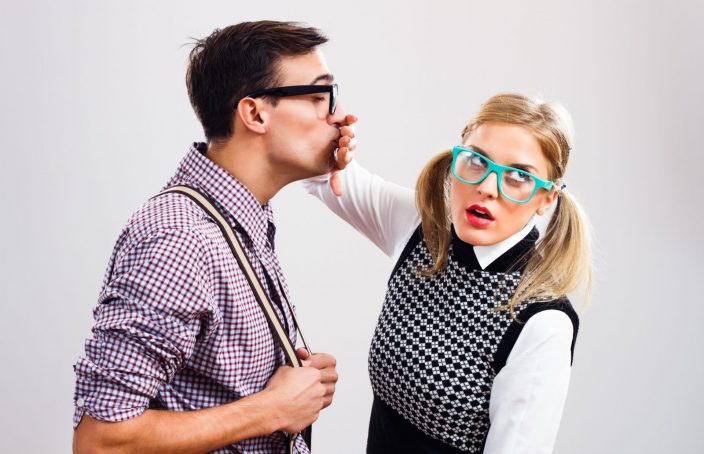 man leans in for kiss and woman stops him